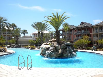 Community Lagoon style pool with Hot tub and Tiki Community gathering area