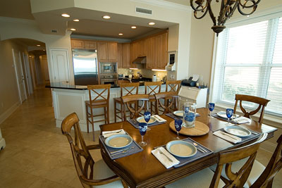 Pottery Barn style dining table affords seating for family and friends.