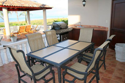 Covered grilling area in rear of villa. 