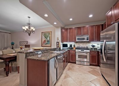Granite counter tops in well-supplied kitchen