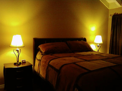 Master Bedroom with luxury Cal King Bed and vaulted ceilings and hanging ceiling fan. Master Bedroom with luxury Cal King Bed and vaulted ceilings and hanging ceiling fan.