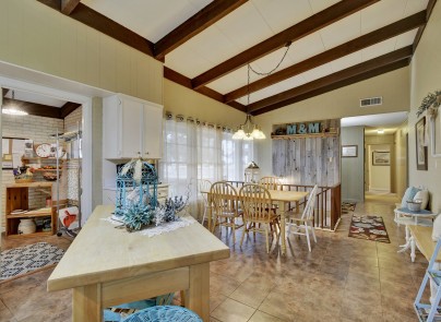 One of five bedrooms, this one with private bath and french doors leading to deck