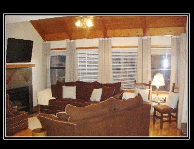 Everything is new in this cozy living room. Sit by the fireplace on the overstuffed sofa