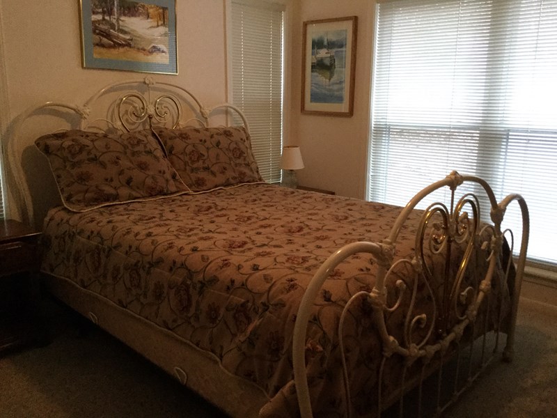 Down stairs to right, two queen beds and two twins