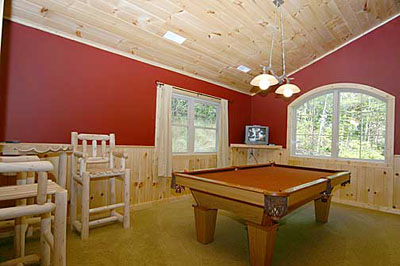 Pool table and TV room with views