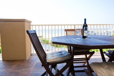 Teak deck chairs for hours on relaxation overlooking the gulf