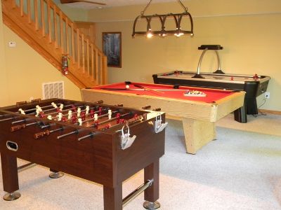 Gameroom with pool table, foos