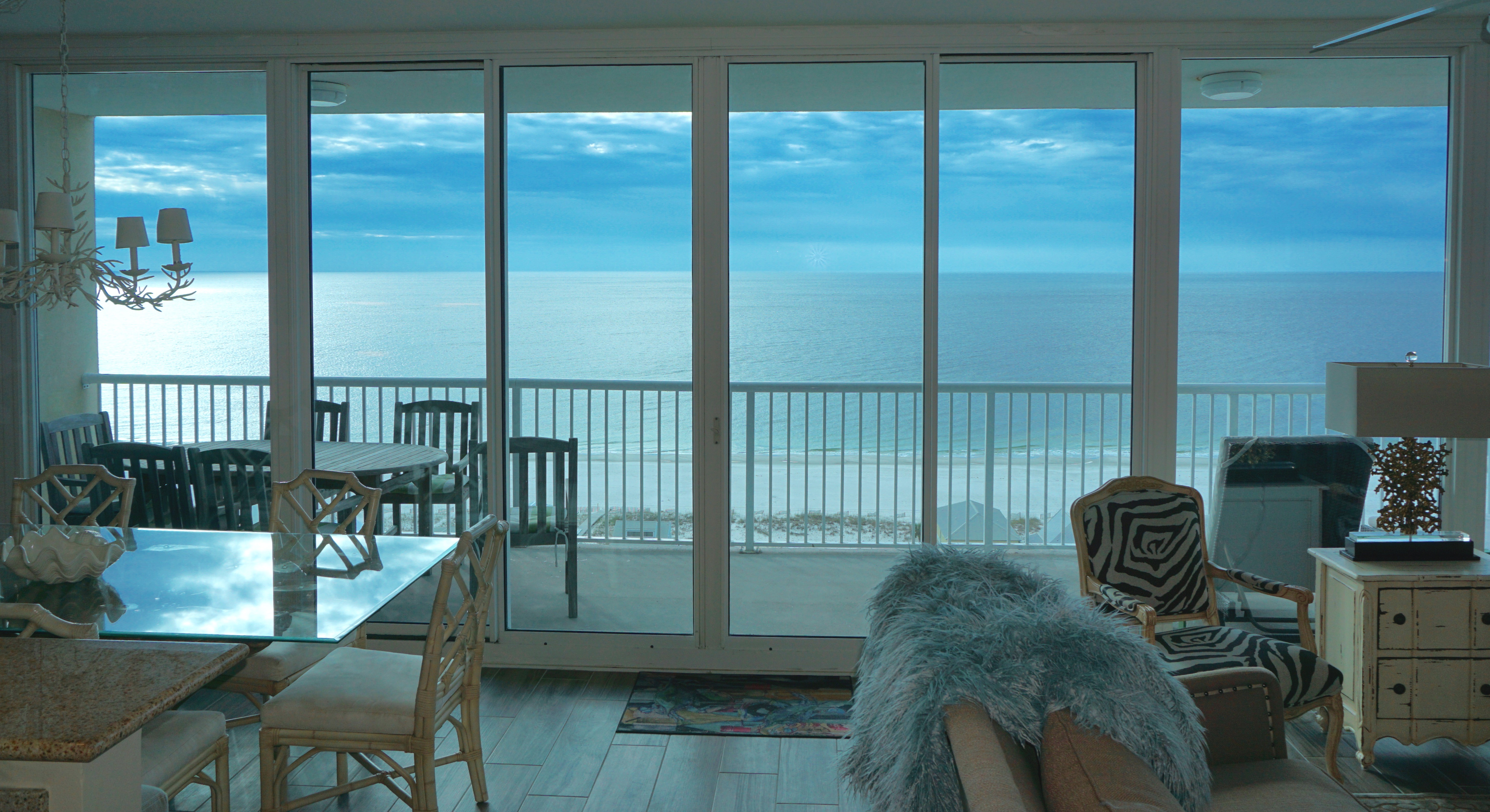 A wall of windows provides a panoramic water view