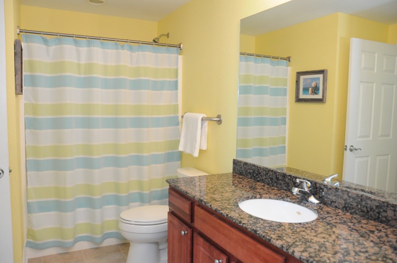 Guest Bathroom with Single Sink, Granite Counter Top and Comfort Toilet