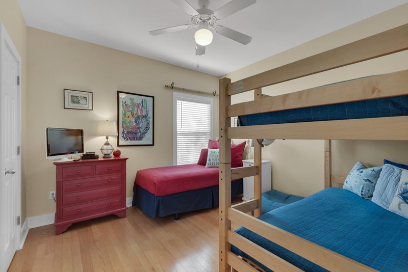 Second floor guest bedroom has flat screen tv and accommodates 4 guest