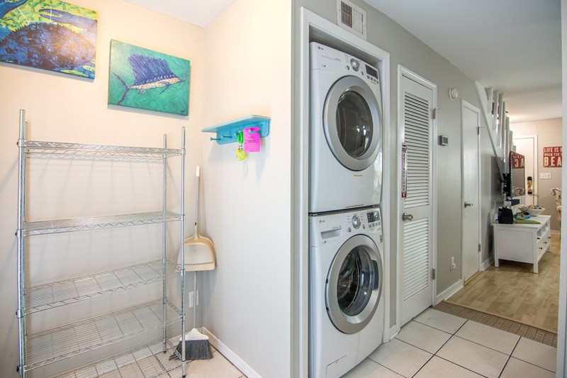Full Size Washer and Dryer / Area for Coolers and Supplies