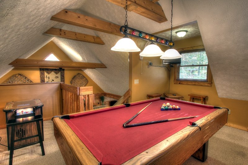Upstairs Game Room has an 8 ft. Pool Table, TV and Vintage Atari Game Center.