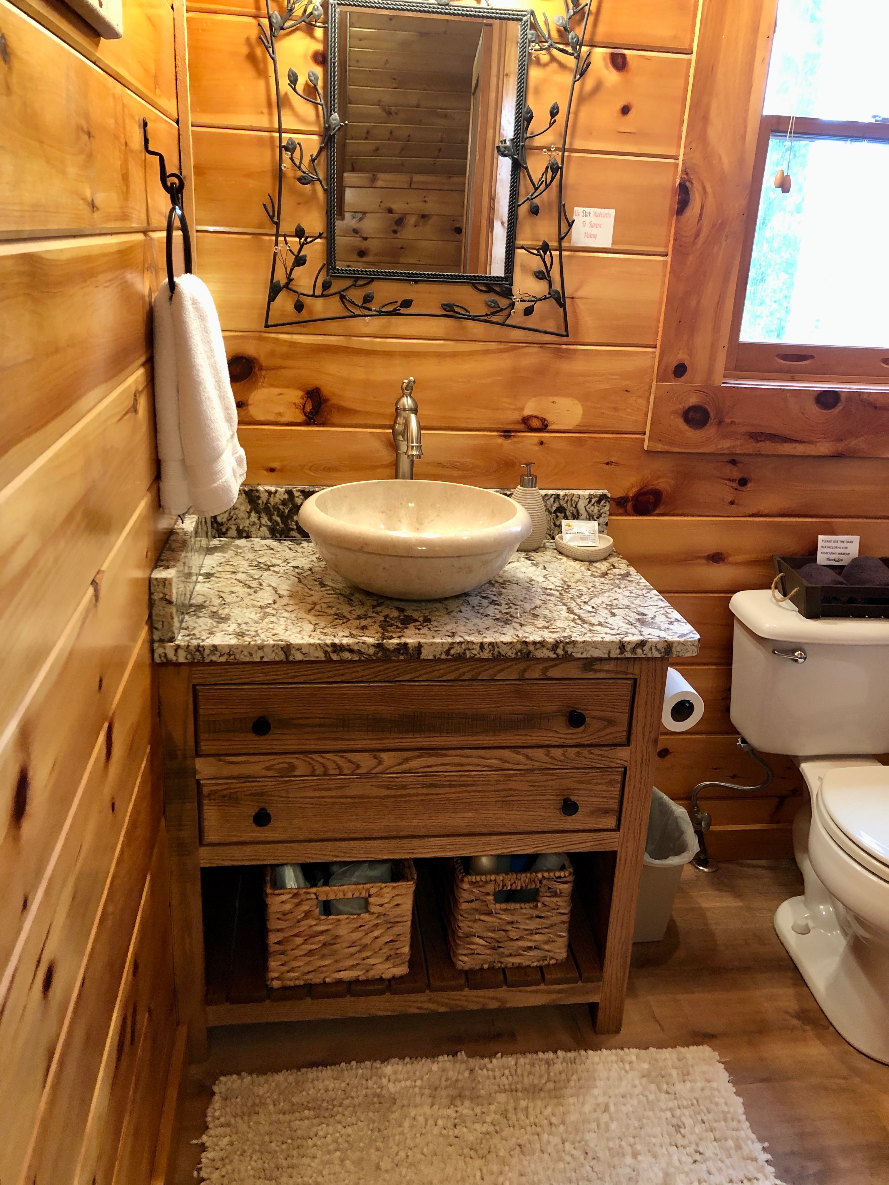 Newly remodeled upstairs bathroom with rustic vanity and granite 2/21