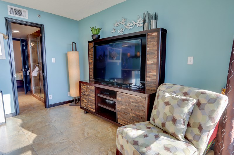 LARGE tv and comfortable seating, tile floor throughout