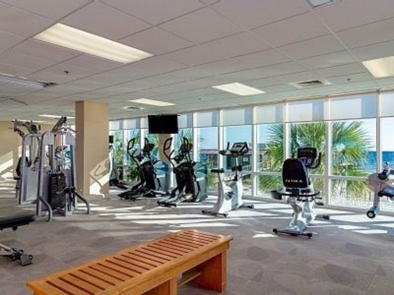 Fitness Center with Sauna, free weights, treadmills, and other machines. Shower area.  Look out over the gulf as you work out