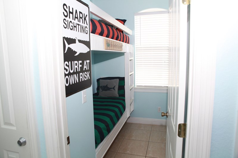 Bunk room on main level with built-in cabinet for clothes, bags or suitcase